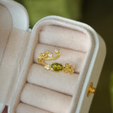 olive-green gemstone ring
